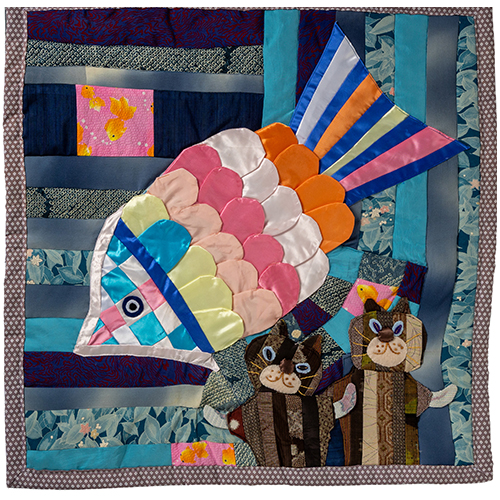 うまそうな魚を虎視眈眈とねらう猫2匹